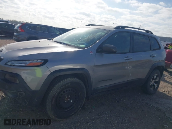 2015 Jeep Cherokee Trailhawk with VIN 1C4PJMBS3FW662307, listed as a IAAI auction lot 41778932 with 64,569 mi miles. Bid and sale history available at carsss.com. Image 14.