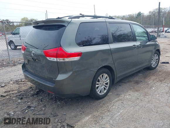 2012 Toyota Sienna XLE AAS with VIN 5TDYK3DC1CS199113, listed as a IAAI auction lot 42123757 with 211,723 mi miles and . Bid and sale history available at carsss.com. Image 4.
