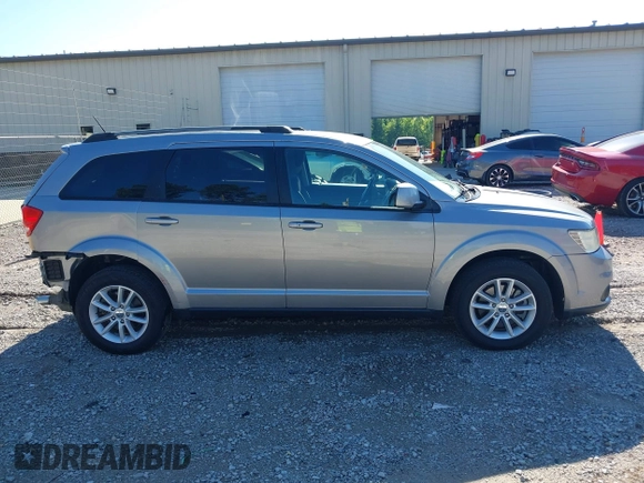 2017 Dodge Journey SXT z VIN 3C4PDCBG4HT563310, wystawiony jako IAAI lot #42190636 z przebiegiem 171 054 mil mil oraz . Historia ofert i sprzedaży dostępna na DreamBid. Obrazek 13.