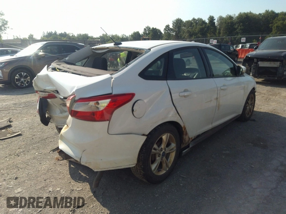 2013 Ford Focus SE with VIN 1FADP3F28DL215983, listed as a IAAI auction lot 42659890 with 117,912 mi miles and . Bid and sale history available at DreamBid. Image 4.
