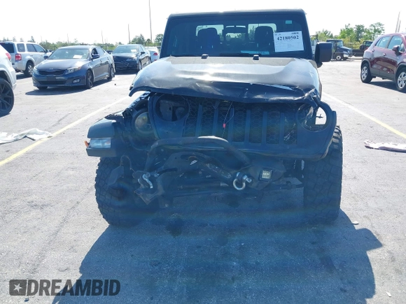 2021 Jeep Gladiator Willys with VIN 1C6HJTAGXML613431, listed as a IAAI auction lot 42180502 with 64,572 mi miles and . Bid and sale history available at DreamBid. Image 5.