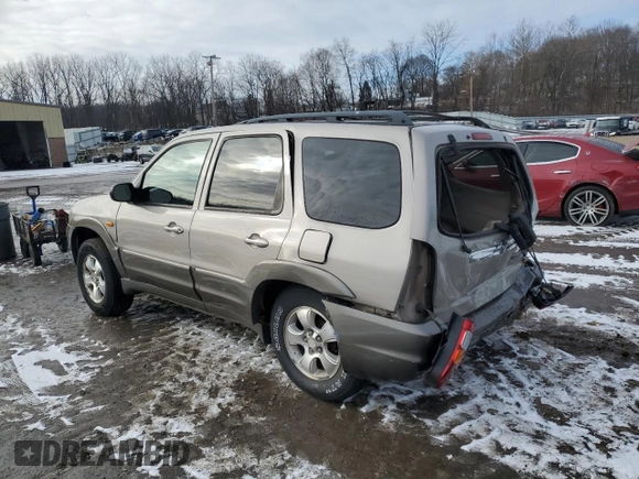 2001 Mazda Tribute LX with VIN 4F2CU081X1KM70119, listed as a Copart auction lot 89311935 with 176,851 mi miles and Salvage Title. Bid and sale history available at DreamBid. Image 2.