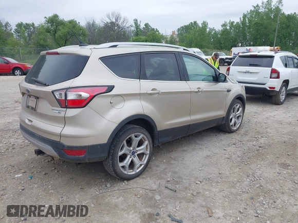 2018 Ford Escape Titanium with VIN 1FMCU9J94JUA44964, listed as a IAAI auction lot 42494471 with 100,955 mi miles and . Bid and sale history available at DreamBid. Image 4.