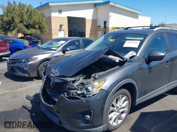 2014 Mazda CX-5 Grand Touring with VIN JM3KE4DY8E0391317, listed as a IAAI auction lot 41871641 with 77,048 mi miles. Bid and sale history available at carsss.com. Image 6.