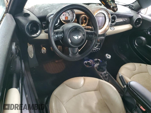 2013 MINI Convertible S with VIN WMWZP3C51DT297891, listed as a Copart auction lot 56745065 with 101,292 mi miles and Salvage title. Bid and sale history available at DreamBid. Image 8.
