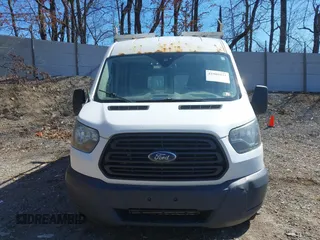 2016 Ford Transit Cargo z VIN 1FTYR2CG4GKA82911, wystawiony jako IAAI lot #41909433 z przebiegiem Nie podano mil oraz . Historia ofert i sprzedaży dostępna na DreamBid. Obrazek 13.