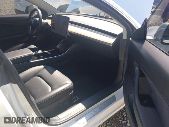 2018 Tesla Model 3 Long Range Battery with VIN 5YJ3E1EA7JF020173, listed as a IAAI auction lot 42046312 with 83,395 mi miles and . Bid and sale history available at DreamBid. Image 5.