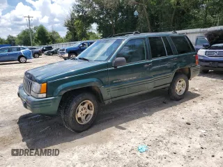 1998 Jeep Grand Cherokee Laredo with VIN 1J4GZ48S5WC289251, listed as a Copart auction lot 63594685 with 156,358 mi miles and Salvage title. Bid and sale history available at DreamBid. Image 1.
