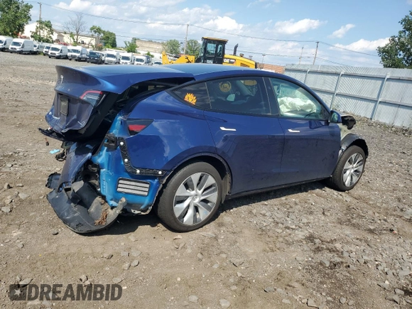 2024 Tesla Model Y Long Range with VIN 7SAYGAEEXRF983702, listed as a Copart auction lot 61536565 with Not provided miles and Salvage title. Bid and sale history available at DreamBid. Image 3.