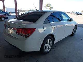 2014 Chevrolet Cruze 1LT with VIN 1G1PC5SB7E7298751, listed as a IAAI auction lot 41714596 with 94,864 mi miles and . Bid and sale history available at DreamBid. Image 4.