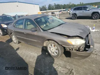 2003 Ford Taurus SEL Deluxe with VIN 1FAHP56SX3A243775, listed as a Copart auction lot 72245394 with 251,041 mi miles and Salvage Title. Bid and sale history available at DreamBid. Image 4.
