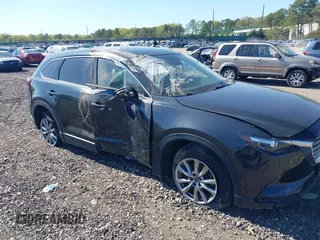 2019 Mazda CX-9 Touring z VIN JM3TCBCY7K0318855, wystawiony jako IAAI lot #39356641 z przebiegiem 55 029 mil mil oraz . Historia ofert i sprzedaży dostępna na DreamBid. Obrazek 1.