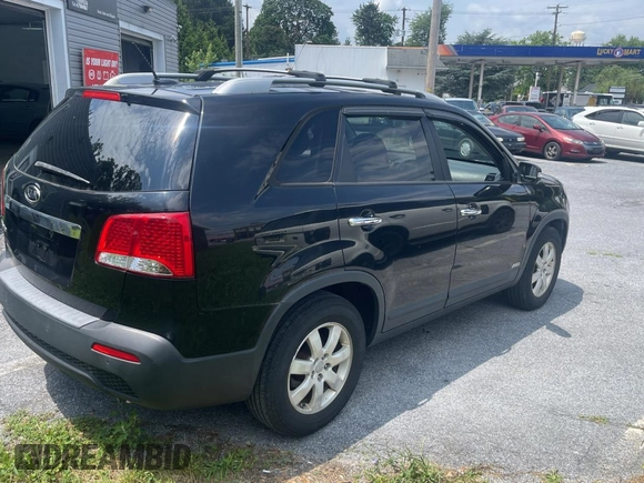 2013 Kia Sorento LX with VIN 5XYKTCA65DG324775, listed as a Copart auction lot 63433705 with 128,031 mi miles and Clean title. Bid and sale history available at DreamBid. Image 4.