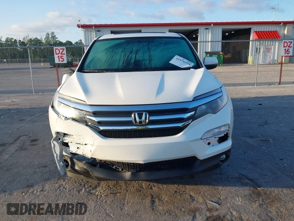 2017 Honda Pilot EX-L with VIN 5FNYF6H51HB037690, listed as a IAAI auction lot 41976359 with 126,055 mi miles and . Bid and sale history available at DreamBid. Image 12.
