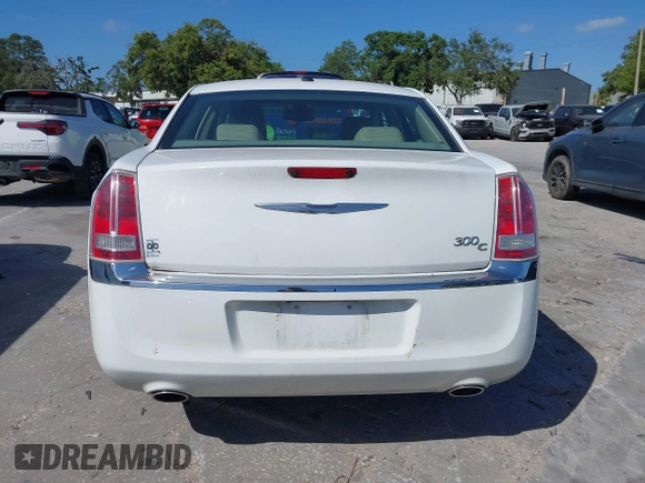 2014 Chrysler 300 with VIN 2C3CCAET6EH173381, listed as a IAAI auction lot 42158270 with 124,551 mi miles. Bid and sale history available at carsss.com. Image 16.