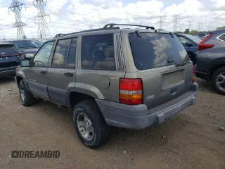 1997 Jeep Grand Cherokee Laredo z VIN 1J4GZ58S4VC502596, wystawiony jako Copart lot #88255865 z przebiegiem Nie podano mil oraz Nie do naprawy • Non repairable. Historia ofert i sprzedaży dostępna na DreamBid. Obrazek 2.
