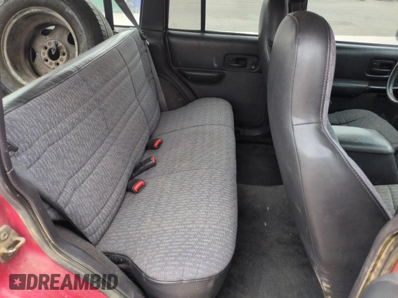 1999 Jeep Cherokee Sport with VIN 1J4FF68S2XL648735, listed as a Copart auction lot 58758115 with 252,248 mi miles and Salvage title. Bid and sale history available at DreamBid. Image 11.