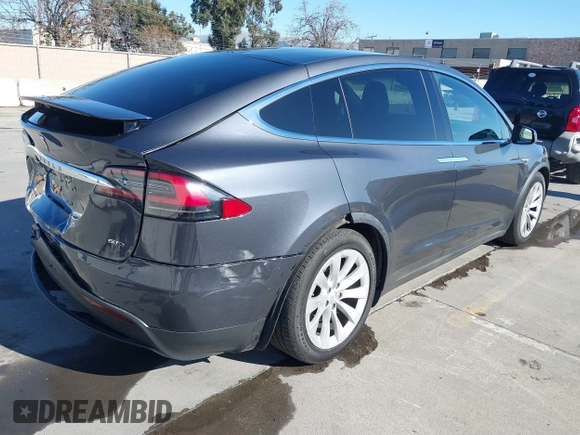 2016 Tesla Model X 70D with VIN 5YJXCBE24GF019450, listed as a IAAI auction lot 41517321 with 96,831 mi miles. Bid and sale history available at carsss.com. Image 4.