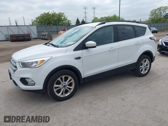 2018 Ford Escape SE z VIN 1FMCU9GDXJUC99453, wystawiony jako IAAI lot #42195202 z przebiegiem 191 840 mil mil oraz . Historia ofert i sprzedaży dostępna na DreamBid. Obrazek 2.
