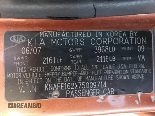 2007 Kia Spectra with VIN KNAFE162X75009714, listed as a Copart auction lot 69094894 with 206,173 mi miles and Salvage Title. Bid and sale history available at carsss.com. Image 12.
