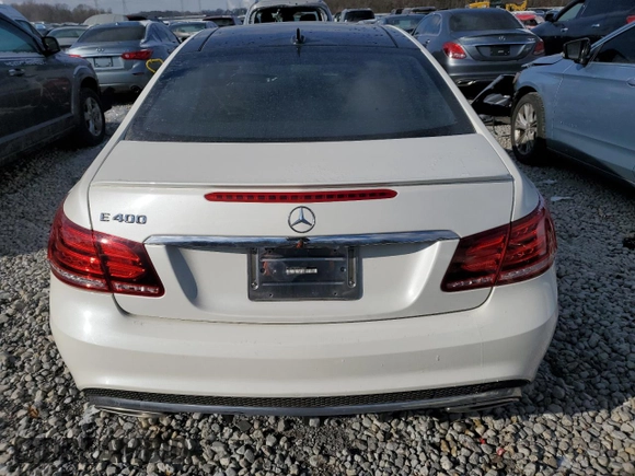 2016 Mercedes-Benz E-Class E 400 with VIN WDDKJ6FB0GF348458, listed as a Copart auction lot 87701385 with 124,867 mi miles and Salvage Title. Bid and sale history available at carsss.com. Image 6.