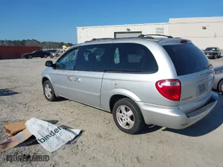 2005 Dodge Caravan SXT with VIN 2D4GP44L45R477780, listed as a IAAI auction lot 41654075 with 166,060 mi miles. Bid and sale history available at carsss.com. Image 3.