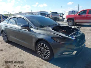 2017 Ford Fusion Titanium with VIN 3FA6P0K98HR124035, listed as a IAAI auction lot 42307936 with Not provided miles and . Bid and sale history available at DreamBid. Image 1.