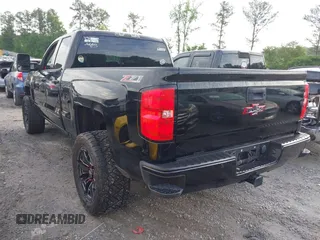 2017 Chevrolet Silverado 1500 LT with VIN 1GCVKREC1HZ197985, listed as a IAAI auction lot 42248714 with 142,123 mi miles and . Bid and sale history available at DreamBid. Image 3.
