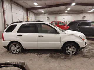 2010 Kia Sportage LX with VIN KNDKGCA35A7718764, listed as a IAAI auction lot 41512368 with 122,420 mi miles and . Bid and sale history available at carsss.com. Image 13.