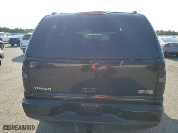2004 GMC Yukon Denali with VIN 1GKEK63U74J212674, listed as a Copart auction lot 69704734 with 174,893 mi miles and Salvage Title. Bid and sale history available at carsss.com. Image 6.