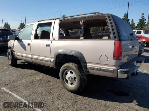 1993 GMC Suburban z VIN 1GKGK26NXPJ711771, wystawiony jako Copart lot #85515174 z przebiegiem 63 064 mil mil oraz Szkoda całkowita • Salvage title. Historia ofert i sprzedaży dostępna na DreamBid. Obrazek 2.