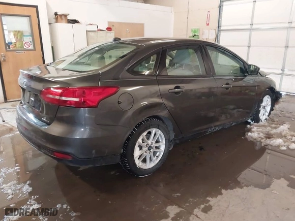 2015 Ford Focus SE with VIN 1FADP3F22FL334793, listed as a IAAI auction lot 41488994 with 58,314 mi miles. Bid and sale history available at carsss.com. Image 4.