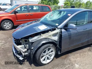 2023 Tesla Model Y Long Range with VIN 7SAYGAEE7PF615751, listed as a IAAI auction lot 42297819 with 31,201 mi miles and . Bid and sale history available at DreamBid. Image 6.
