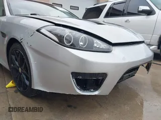 2008 Hyundai Tiburon GT z VIN KMHHN66F18U268929, wystawiony jako IAAI lot #42107550 z przebiegiem 142 547 mil mil oraz . Historia ofert i sprzedaży dostępna na DreamBid. Obrazek 12.