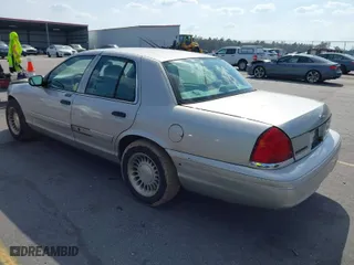 2004 Ford Crown Victoria Standard with VIN 2FAFP73W94X107561, listed as a IAAI auction lot 41804985 with 128,066 mi miles. Bid and sale history available at carsss.com. Image 3.
