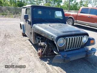 2005 Jeep Wrangler Unlimited with VIN 1J4FA44S25P385421, listed as a IAAI auction lot 42039381 with 1 mi miles. Bid and sale history available at carsss.com. Image 6.