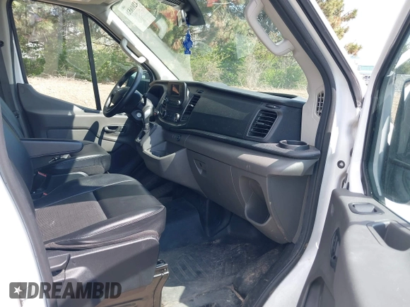 2021 Ford Transit Cargo with VIN 1FTBR1C85MKA66513, listed as a IAAI auction lot 42016528 with 18,174 mi miles and . Bid and sale history available at DreamBid. Image 5.