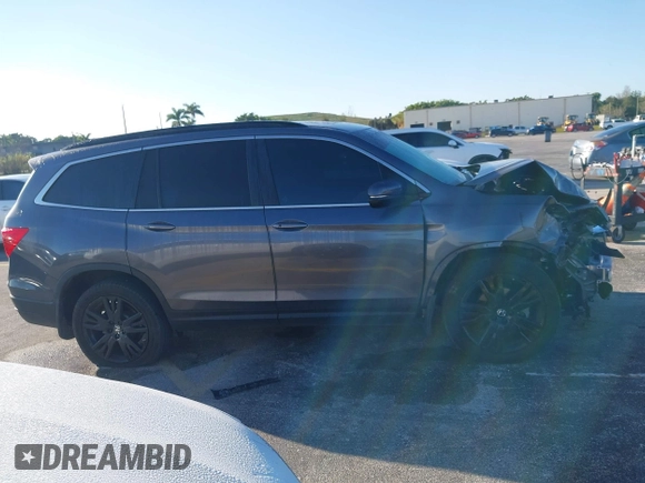 2022 Honda Pilot Special Edition with VIN 5FNYF5H25NB031399, listed as a IAAI auction lot 41638517 with 34,239 mi miles and . Bid and sale history available at carsss.com. Image 14.