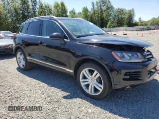 2013 Volkswagen Touareg Lux with VIN WVGEF9BP0DD001565, listed as a Copart auction lot 63070845 with 123,788 mi miles and Salvage title. Bid and sale history available at DreamBid. Image 4.