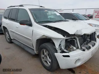 2003 GMC Envoy SLE with VIN 1GKDS13S532253648, listed as a IAAI auction lot 41850094 with 147,254 mi miles. Bid and sale history available at carsss.com. Image 1.