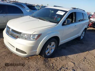 2014 Dodge Journey SE with VIN 3C4PDCAB4ET119412, listed as a IAAI auction lot 41760074 with 148,882 mi miles. Bid and sale history available at carsss.com. Image 2.