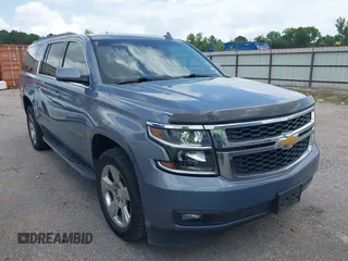 2015 Chevrolet Suburban LT z VIN 1GNSCJKC5FR637104, wystawiony jako IAAI lot #42445247 z przebiegiem 140 571 mil mil oraz . Historia ofert i sprzedaży dostępna na DreamBid. Obrazek 1.