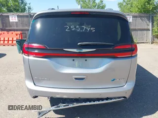 2021 Chrysler Pacifica Hybrid Touring L with VIN 2C4RC1L76MR594571, listed as a IAAI auction lot 40255745 with 58,163 mi miles and . Bid and sale history available at DreamBid. Image 16.