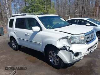 2011 Honda Pilot Touring with VIN 5FNYF4H96BB014095, listed as a IAAI auction lot 41794052 with 202,440 mi miles and . Bid and sale history available at DreamBid. Image 1.