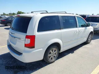 2012 Chrysler Town & Country Touring with VIN 2C4RC1BG7CR308985, listed as a IAAI auction lot 42015578 with 196,604 mi miles. Bid and sale history available at carsss.com. Image 4.