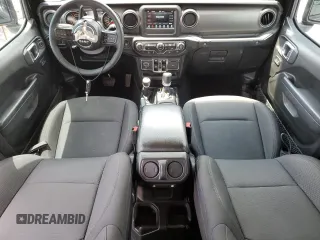 2023 Jeep Gladiator Sport S with VIN 1C6HJTAG9PL525183, listed as a Copart auction lot 54556735 with 13,805 mi miles and Salvage title. Bid and sale history available at DreamBid. Image 8.