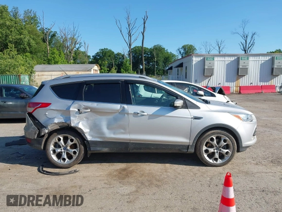 2016 Ford Escape Titanium with VIN 1FMCU9J97GUB91966, listed as a IAAI auction lot 42378829 with 121,218 mi miles and . Bid and sale history available at DreamBid. Image 13.