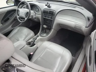 2001 Ford Mustang Deluxe с VIN 1FAFP444X1F234869, выставлен на аукционе Copart как лот 57380035 с пробегом 84 074 миль миль и Списание • Salvage title. История ставок и продаж доступна на DreamBid. Изображение 8.