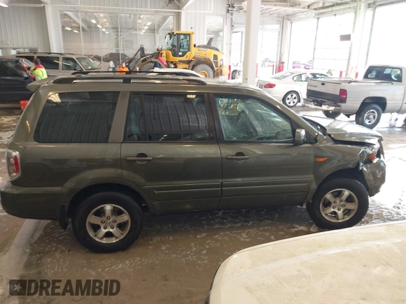 2006 Honda Pilot EX-L with VIN 5FNYF187X6B026463, listed as a IAAI auction lot 41612181 with 242,828 mi miles and . Bid and sale history available at DreamBid. Image 13.
