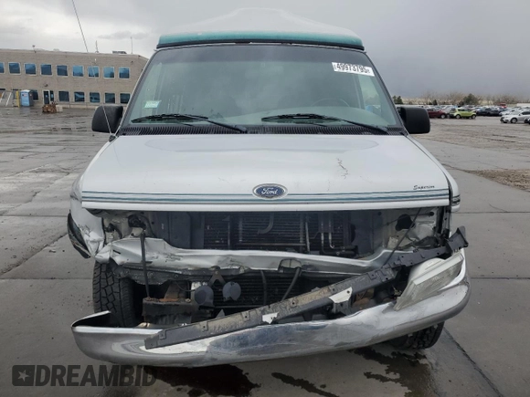 1999 Ford Econoline Cargo Recreational with VIN 1FDRE14L3XHA31771, listed as a Copart auction lot 49973795 with 220,268 mi miles and Salvage title. Bid and sale history available at DreamBid. Image 5.